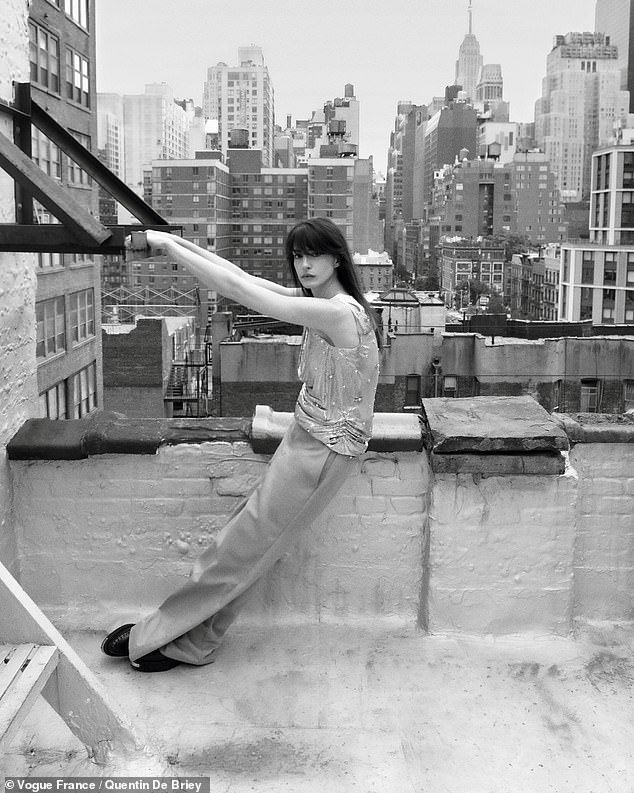 Another rooftop image saw her wearing a Versace top, Dickies pants, and Gucci shoes